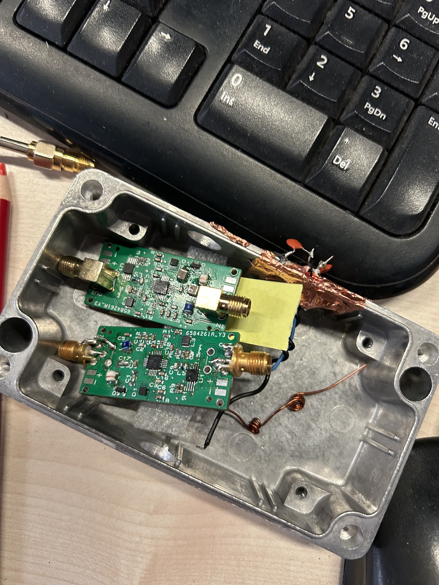 Two small preamplifier circuit boards inside an open aluminum enclosure